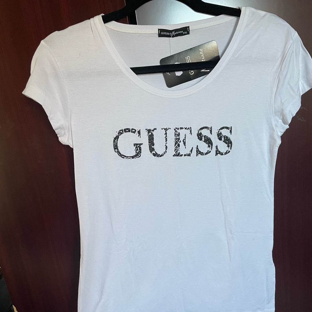Guess shirt. It’s says XXL but it’s more like Small size